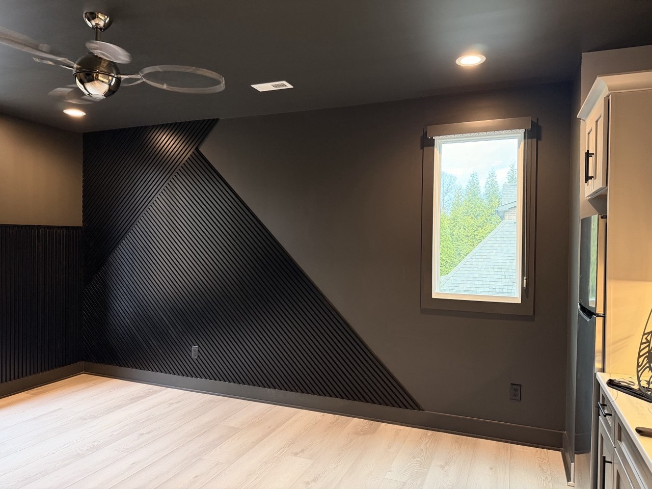 Completed black geometric accent wall